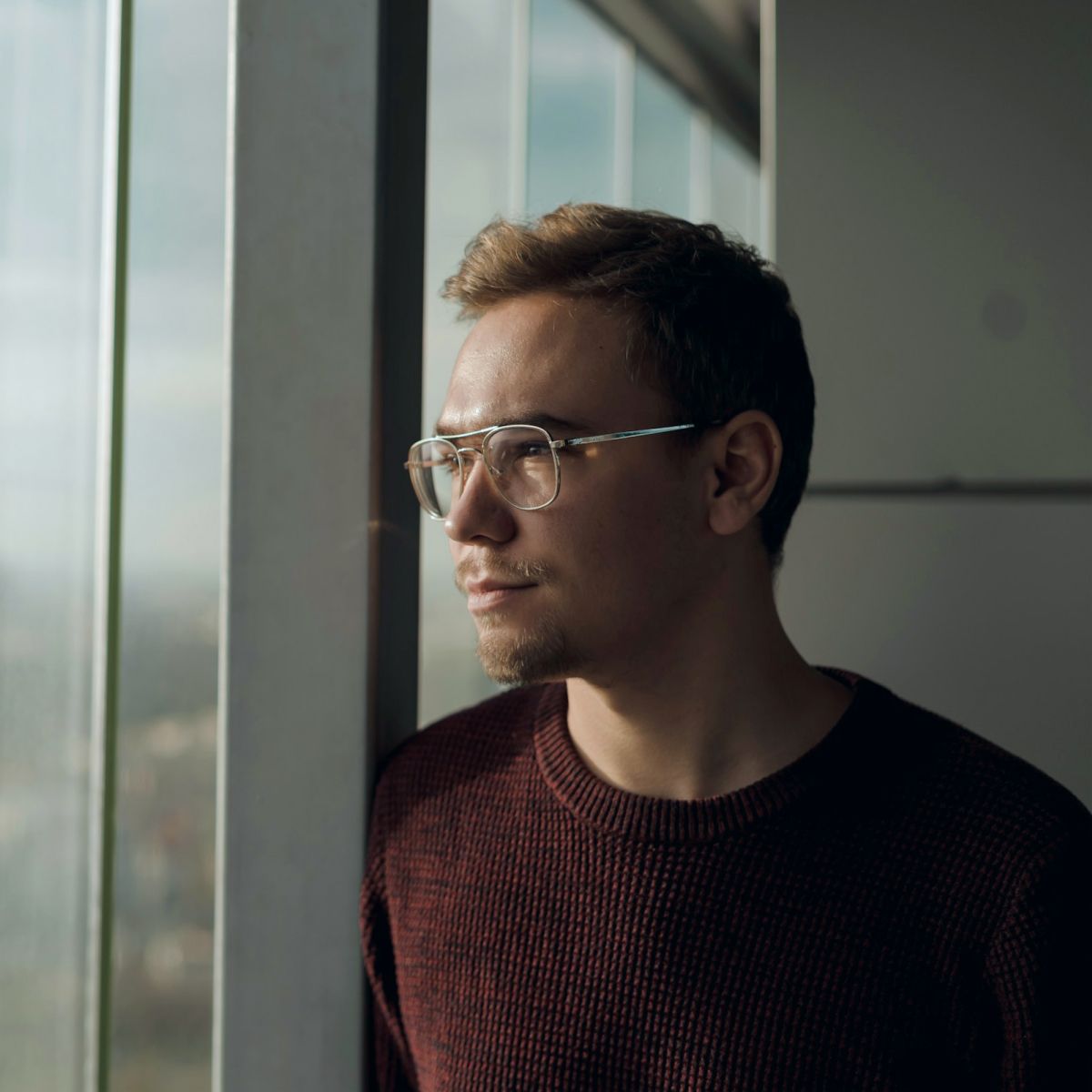 a person looking out of a window